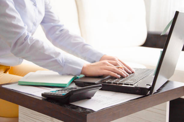 istock business woman working at home on the computer. online work 1262763371