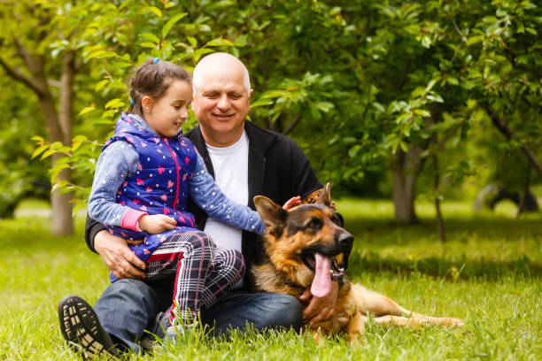 istock Beautiful granddaughter visiting her elderly kind grandfather. 1262767498