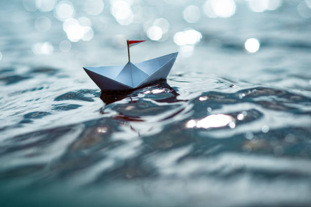 istock Paper Boat on Sunny Sea 1262772868