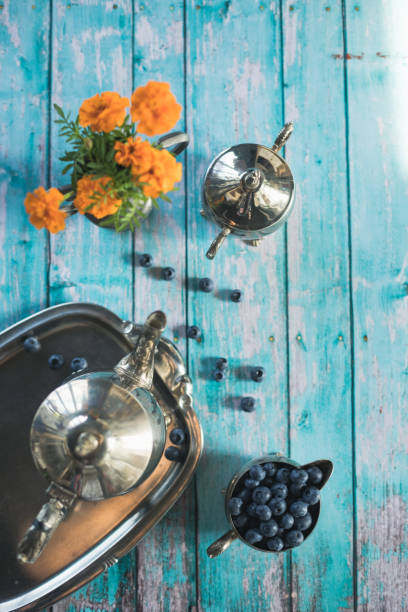Retro style afternoon tea served with fresh blueberries