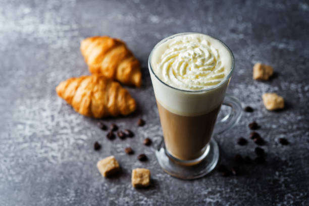 istock Coffee with whipped cream in a glass with coffee beans 1262781108
