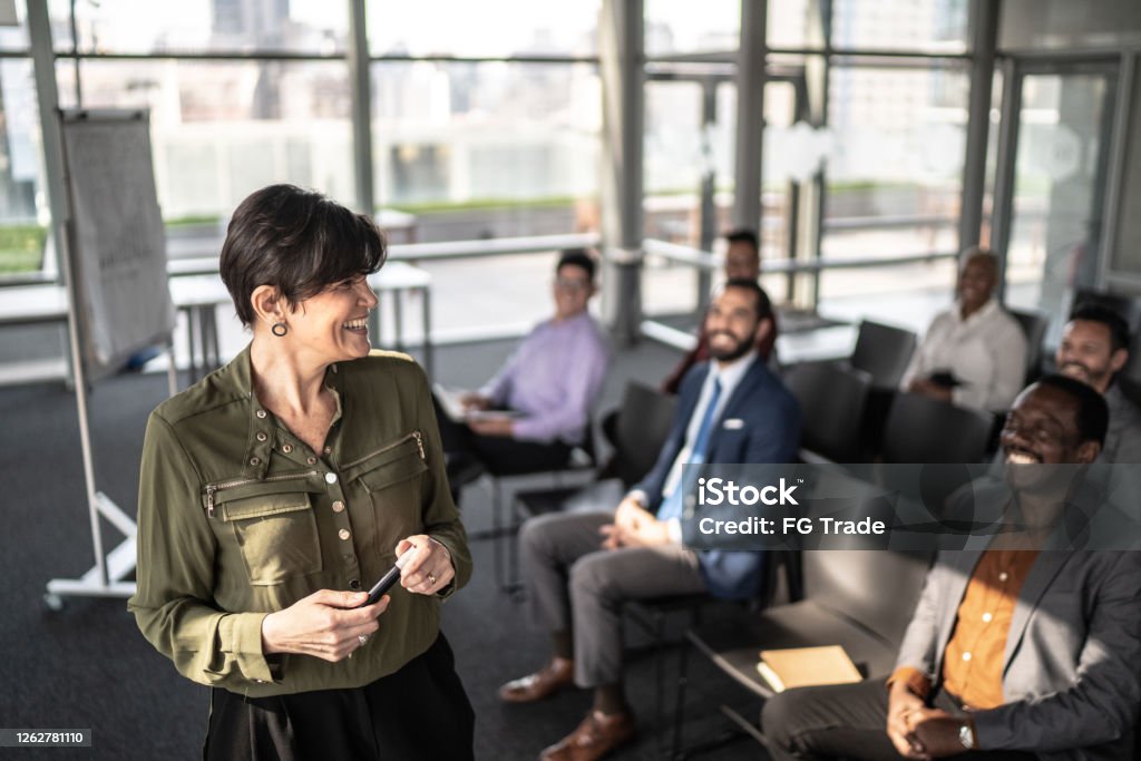 Businesswoman doing a presentation to the team Leadership Stock Photo