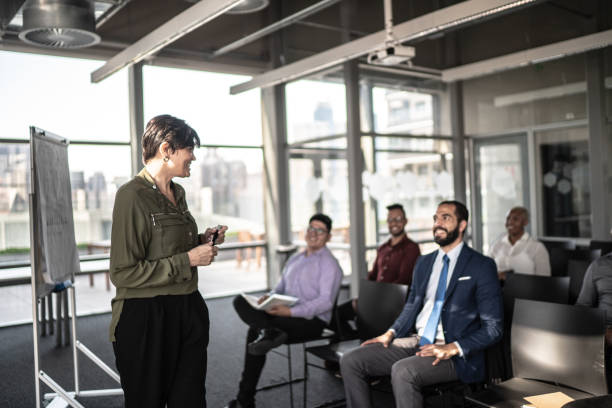 istock Businesswoman doing a presentation to the team 1262781127
