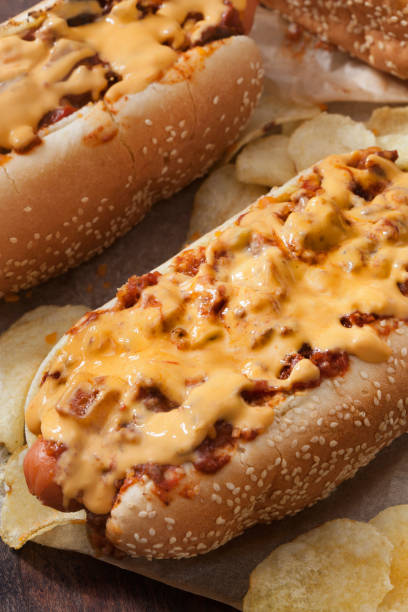 istock Chili Dog with Cheese Sauce and Potato Chips 1262784106