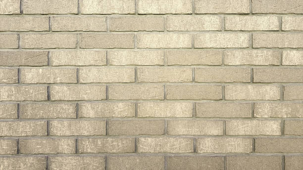 istock Old brick wall texture of stone blocks closeup for beige background. 1262791418