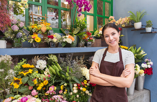 Startup successful sme small business entrepreneur owner asian woman standing with flowers at florist shop. Portrait of caucasian girl successful owner environment friendly concept with copy space