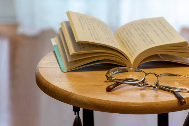 Glasses and book placed on the table