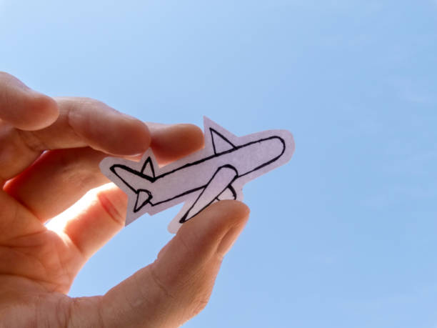 istock Paper airplane against blue sky 1262812852