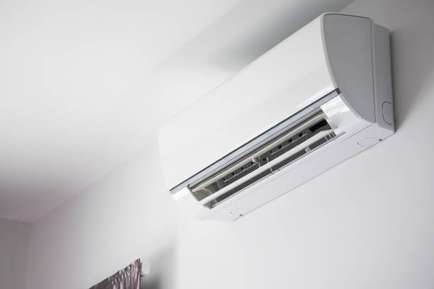 Air conditioner on white wall room interior background