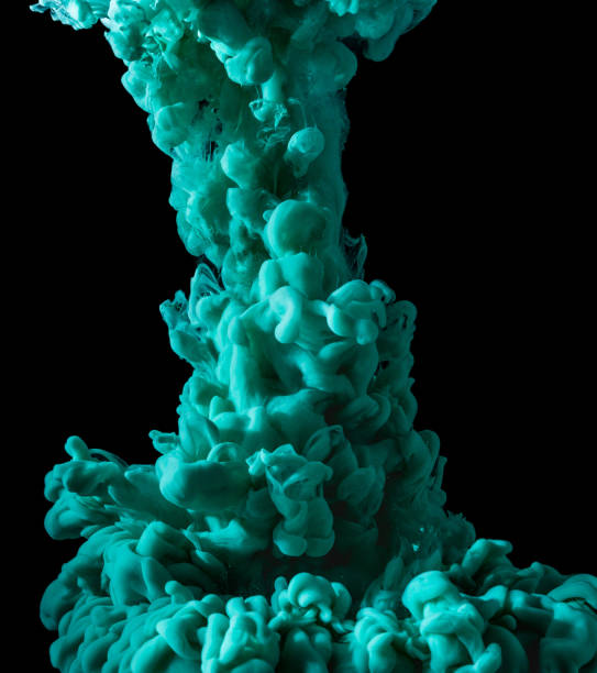 istock Turquoise paint underwater abstract cloud isolated on black background 1262816758