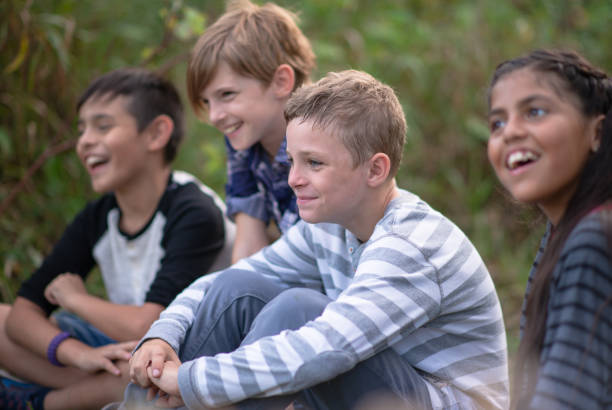 istock Kids laughing together in a natural outdoor setting 1262816889