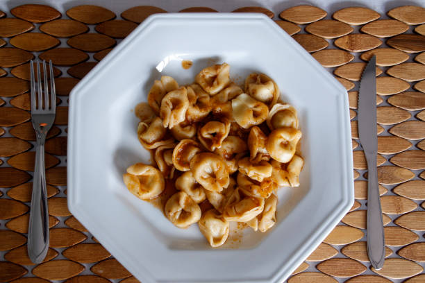 istock Capeletti on white plate on wooden table 1262817867