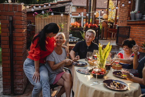 istock Multi generation family spending time together in front yard 1262818904