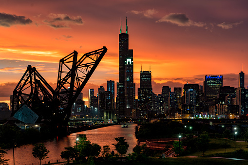 Dramatic sunset over Chicago river and Chicago cityscape