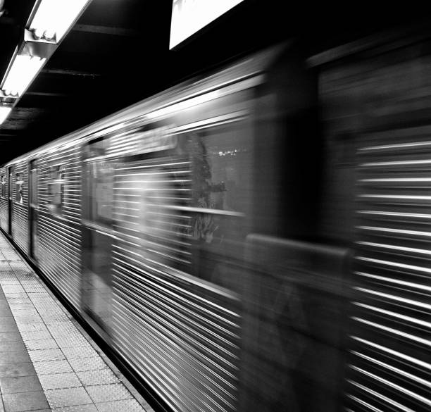 istock NYC subway station train in motion Black and white 1262832047