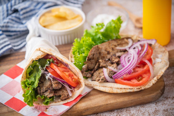 istock wrap gyro on wooden cutting board 1262834652