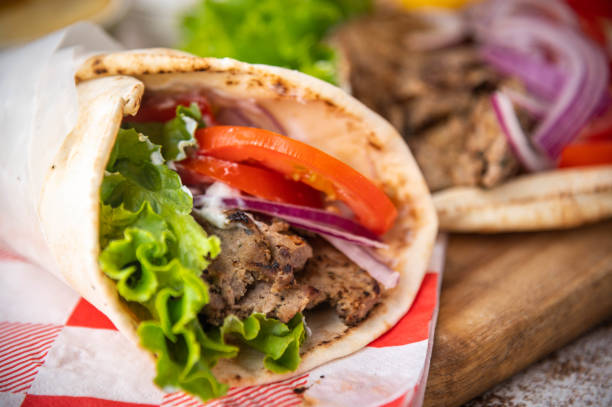 istock wrap gyro on wooden cutting board 1262834661