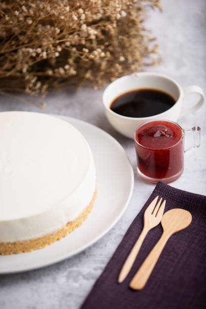 istock Ice box cheese cake with strawberry jam and a cup of coffee . 1262835691