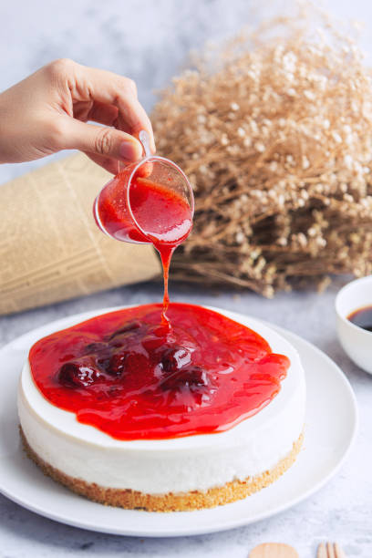 istock Ice box cheese cake with strawberry jam and a cup of coffee . 1262835711