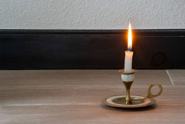 istock Candle light in empty space inside the house in Guatemala during the COVID 19 quarantine, a sign of hope and faith. 1262840640