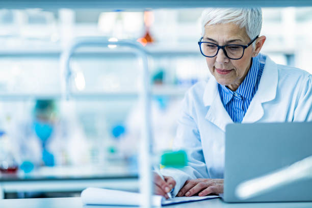 istock Senior female scientists taking notes in laboratory. 1262840653