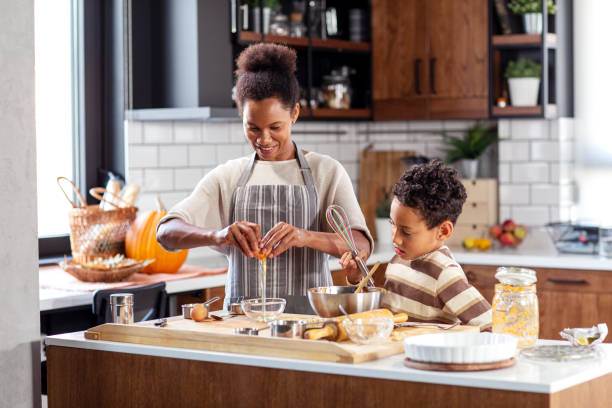 istock Woman prepare pie in the kitchen and learn his son cooking 1262845666