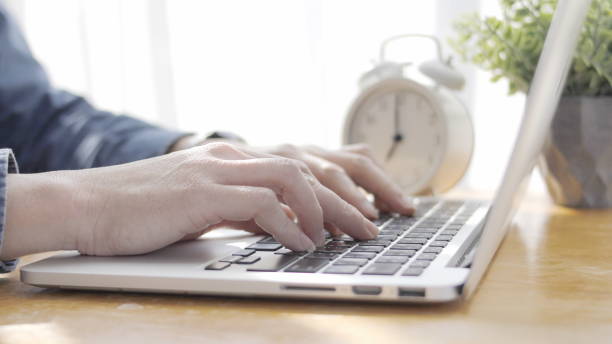 istock hand is typing on the laptop. Use of technology 1262847865