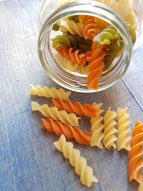 istock Spiral pasta sprinkled from the jar 1262847903