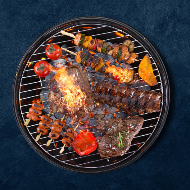 istock Garden grill isolated on blue background 1262848029