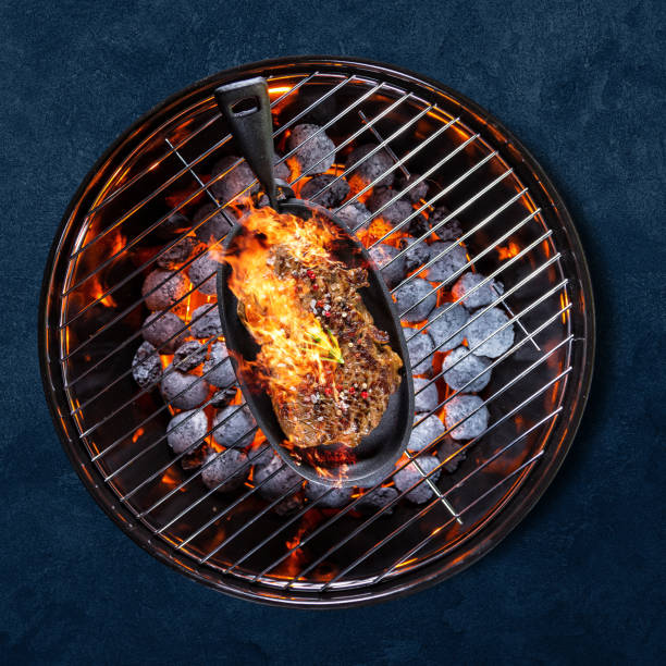 istock Garden grill isolated on blue background 1262848111