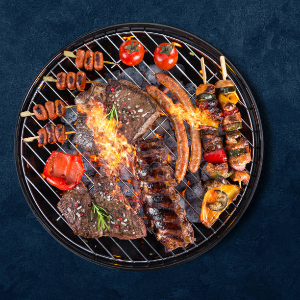 istock Garden grill isolated on blue background 1262848525
