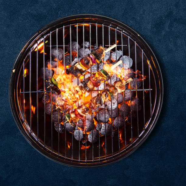 istock Garden grill isolated on blue background 1262848556