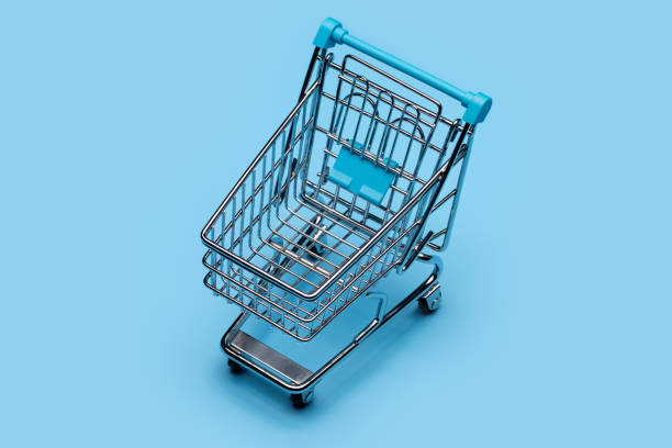 istock Silver toy shopping cart with blue handle. 1262849077