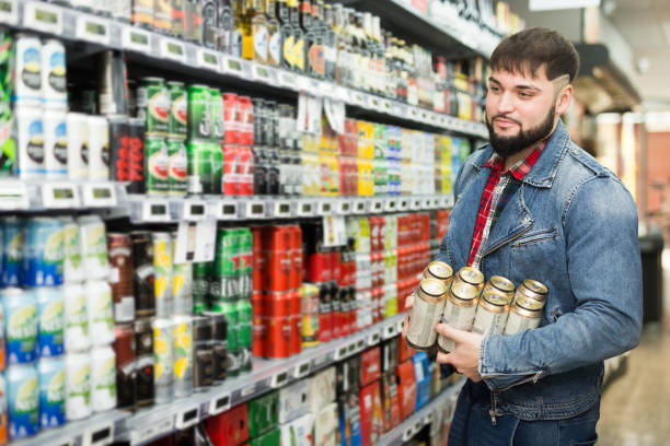 istock man buying canned beer 1262849234