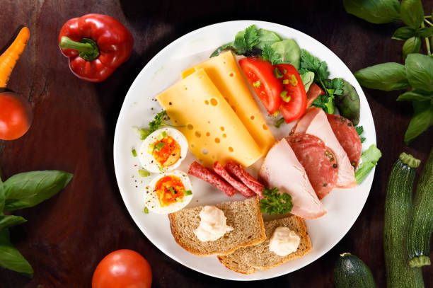 istock breakfast Between the granola, honey, butter, fruit and almonds and egg 1262855944