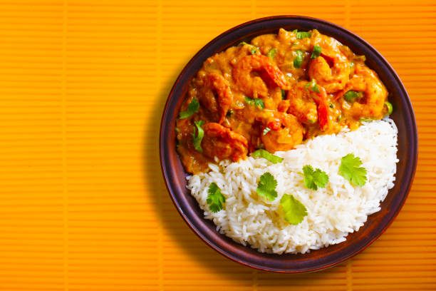 istock Shrimps in curry sauce and rice on a plate 1262858070