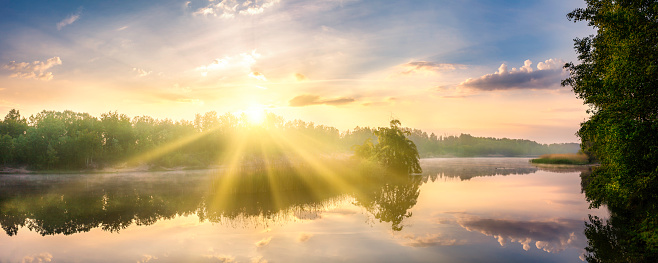 Romantic Sunrise Over a Lake & Forest Landscape