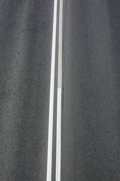 istock Road markings double solid, top view of the paved highway 1262859967