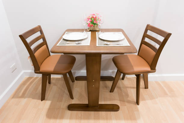 istock wood dining table set up in a room 1262867919
