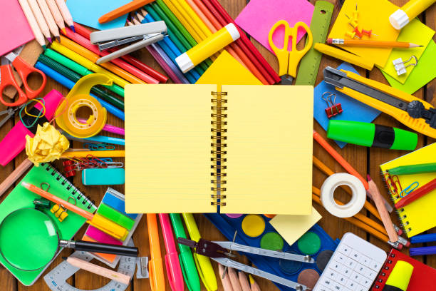 istock School supplies on wooden desk with blank notebook 1262872830