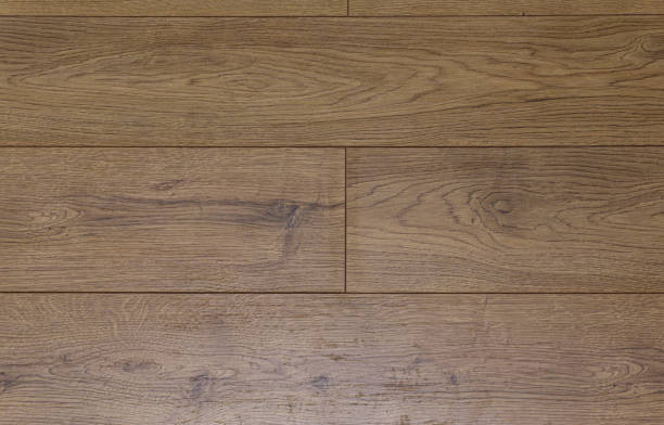 istock Laminate background. Wooden laminate and parquet boards for the floor in interior design. Texture and pattern of natural wood. 1262875310