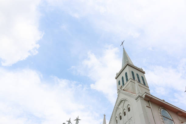 steeple of public church with blue sky in the background steeple of public church with blue sky in the background steeple stock pictures, royalty-free photos & images