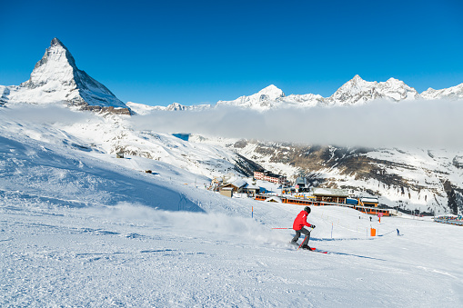 A steeple from the town of Wengen, Switzerland with a view of Lauterbrunnen valley below.