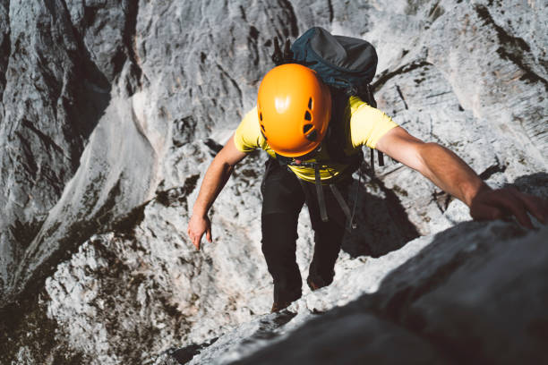 istock Unrecognizable climber climbing up the mountain 1262880232