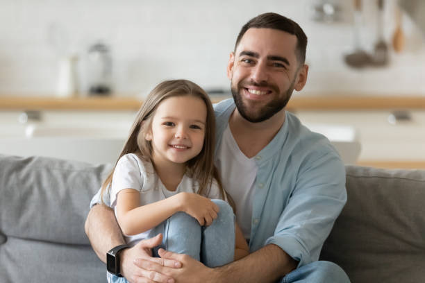 istock Happy young affectionate dad bonding with little child girl. 1262881723