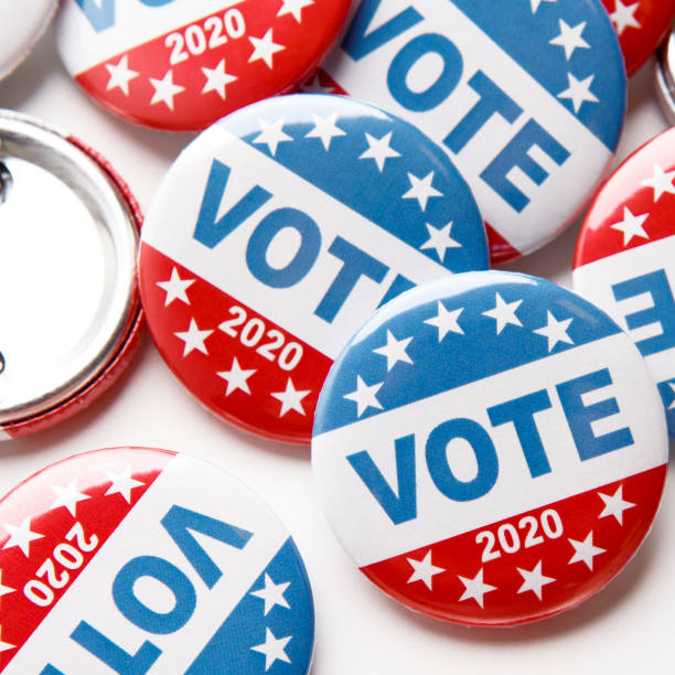 istock Close up of voting pins for 2020 US elections on white 1262883570