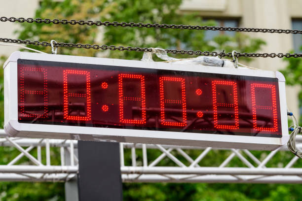 istock Outdoor time panel display for competitors set up on a metallic surface, ready to show the start for a marathon running event, zero hours, minutes and seconds 1262883619