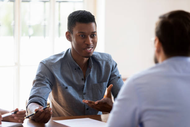 istock African manager express opinion share thoughts during negotiations with clients 1262889200