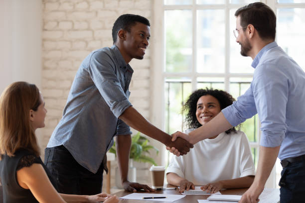 istock Before start negotiations African and Caucasian businessmen handshake express respect 1262889203