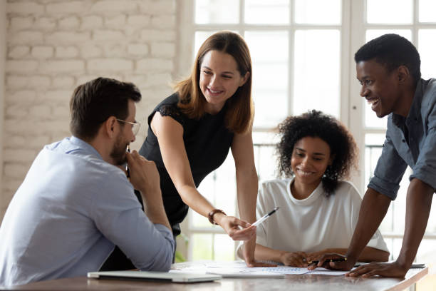 istock Woman mentor teach staff multiethnic workers at corporate briefing 1262889207
